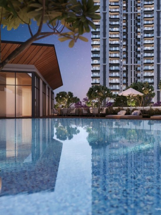 Levante Residences pool and clubhouse at dusk